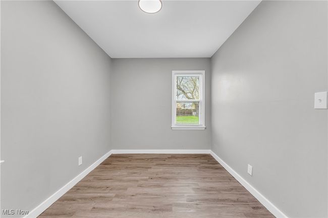 Unfurnished room featuring baseboards and wood finished floors | Image 16