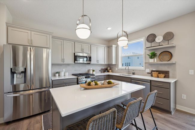 Quartz countertops. This is not the actual home for sale, but photos of the same floorplan. Additional options may be shown. | Image 7
