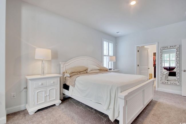 Bedroom with light colored carpet | Image 15