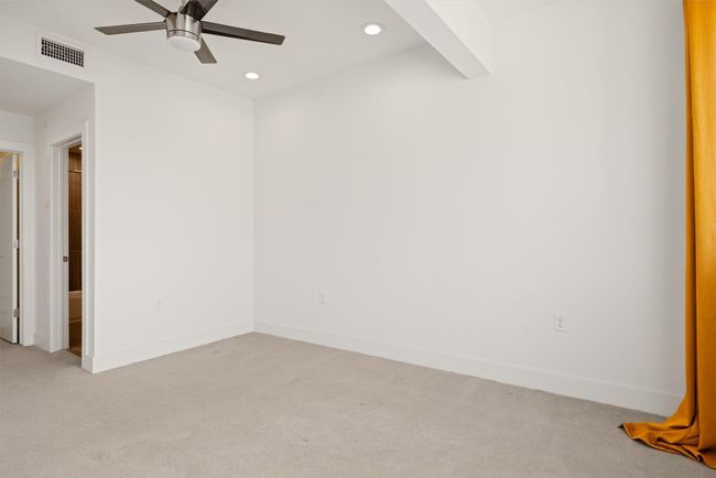 Empty room with light carpet, ceiling fan, and recessed lighting | Image 21