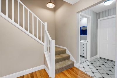 Foyer showing powder room and door to garage. | Image 2