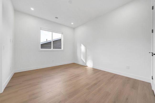 Spare room featuring baseboards, light wood-style flooring, and recessed lighting | Image 15