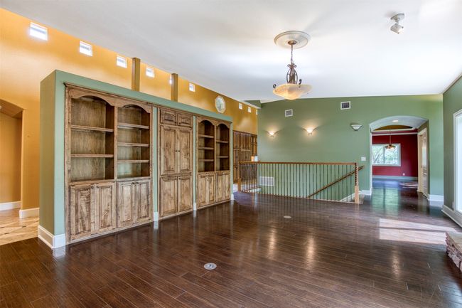 Living room with wall of built-ins. | Image 7