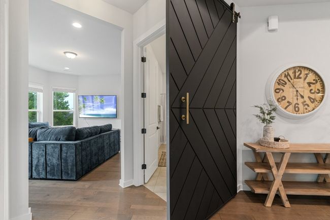 Hall with wood finished floors and recessed lighting | Image 25