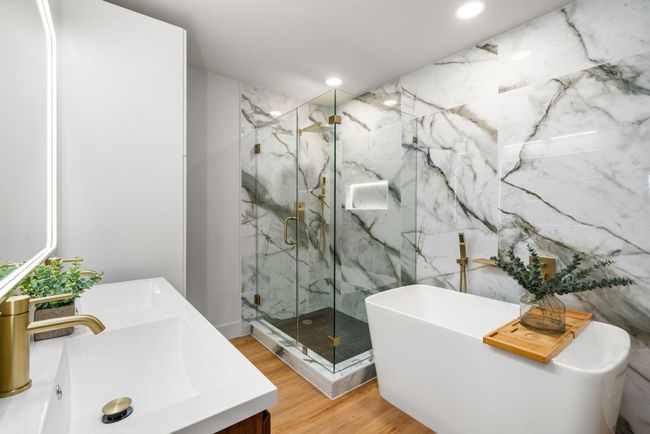 Primary en suite is a sanctuary, also featuring a lighted shower niche | Image 20