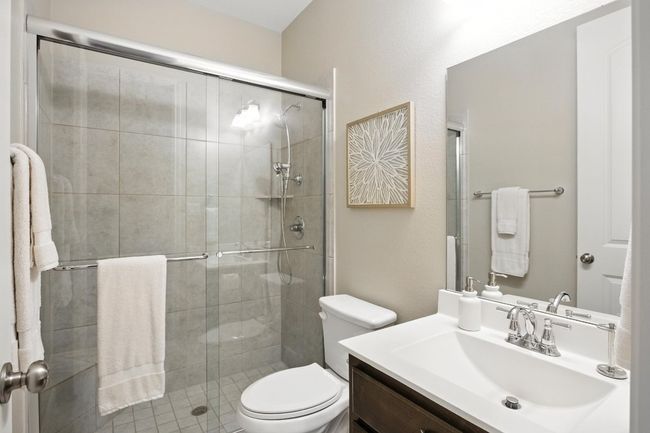 Bathroom with vanity and a shower stall | Image 28