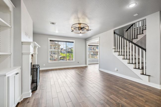 Notice all the upgraded flooring and recently painted walls | Image 11