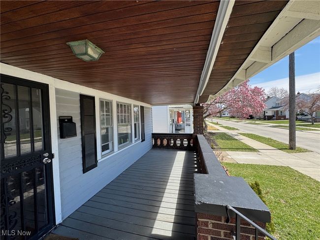 Wooden terrace featuring a porch | Image 4