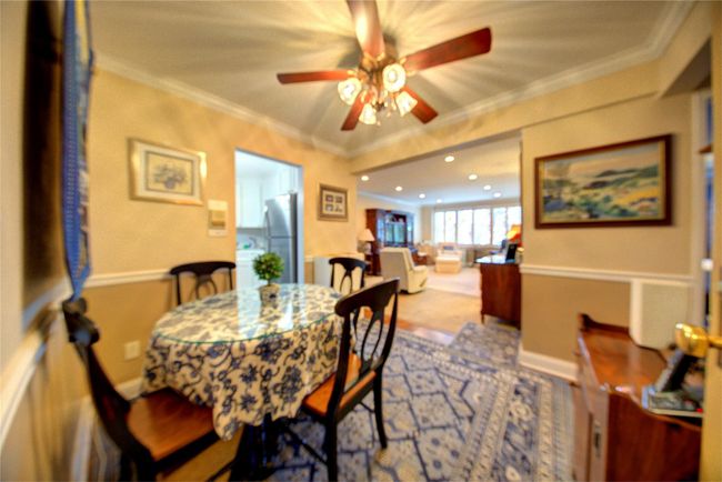 Dining area featuring recessed lighting, crown molding, baseboards, and ceiling fan | Image 9