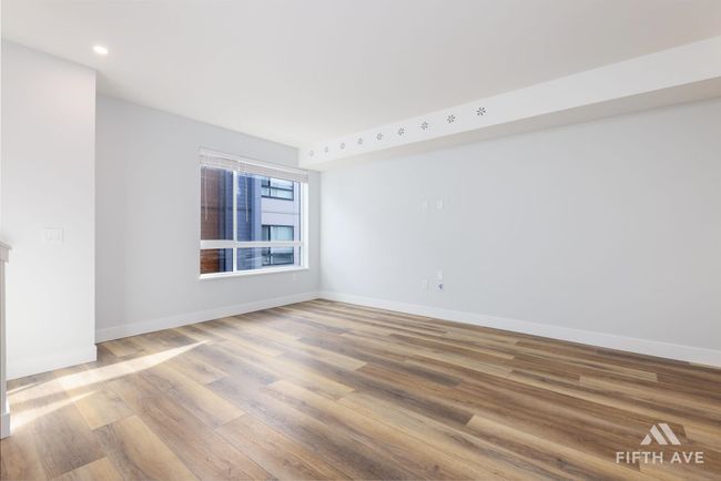 Spare room featuring wood finished floors and recessed lighting | Image 5