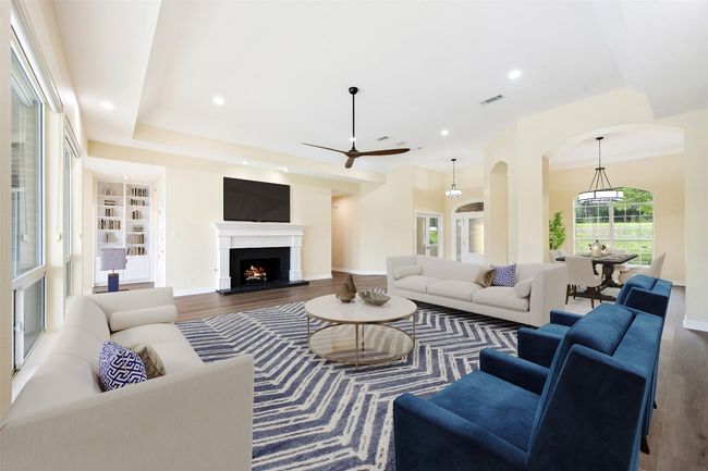 Main living area is generously sized, looks out to pool. Virtually staged. | Image 6