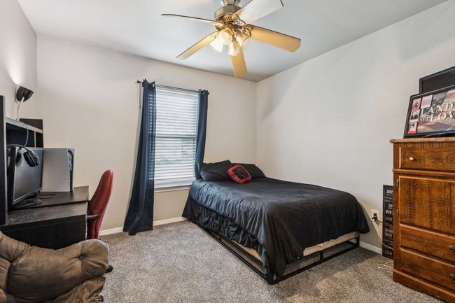 Bedroom featuring carpet and a ceiling fan | Image 21