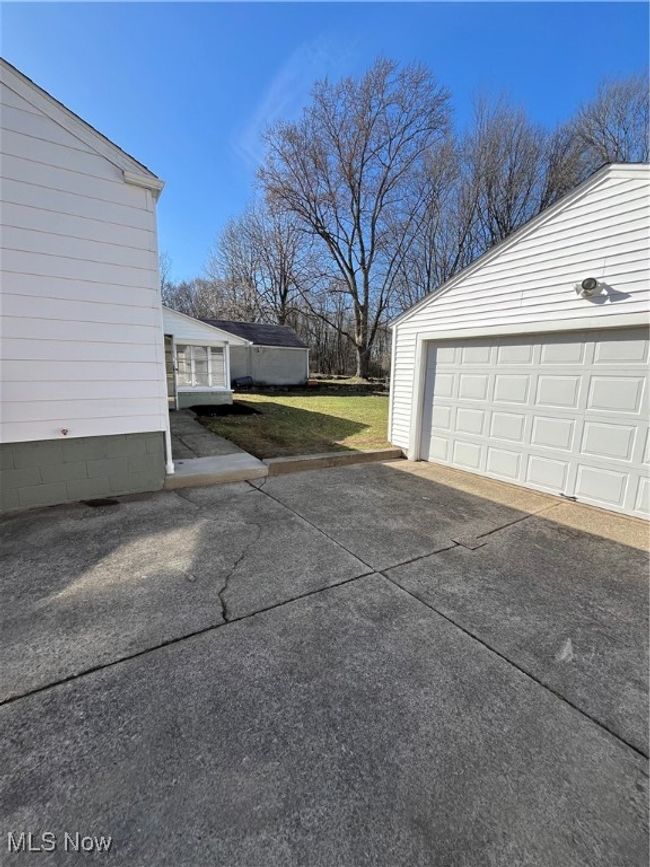 Garage with concrete driveway | Image 32