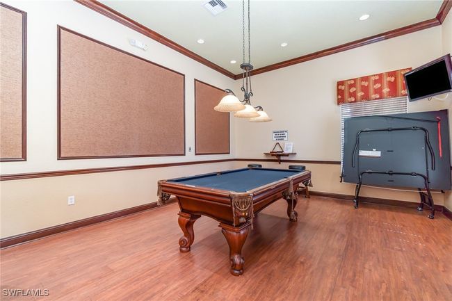 Game room featuring wood finished floors, ornamental molding, billiards, baseboards, and recessed lighting | Image 24