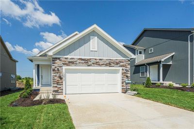 View of front facade with a front lawn | Image 1