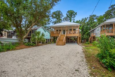 View of front of house with covered porch and ceiling fan | Image 1