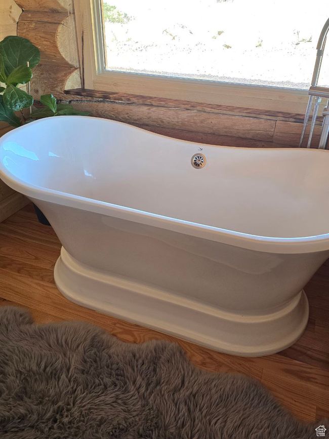 Full bathroom featuring a freestanding tub | Image 75