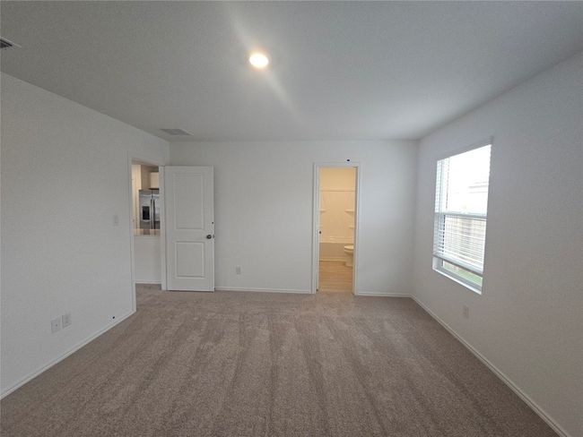 Unfurnished room featuring carpet and baseboards | Image 20