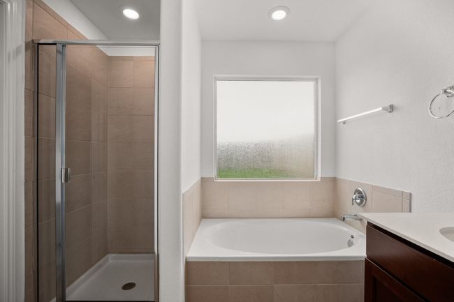 Full bathroom with a garden tub, a shower stall, vanity, and recessed lighting | Image 15