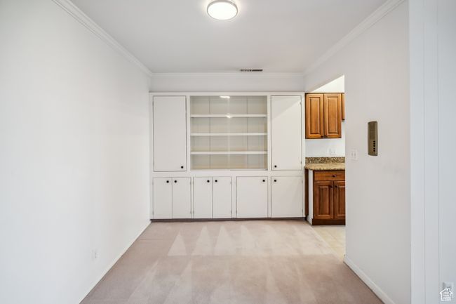 Corridor with ornamental molding and light carpet | Image 6