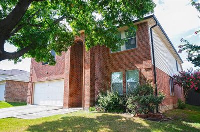 View of front of home featuring a garage and a front yard | Image 3