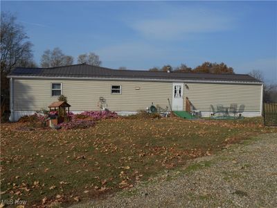 Rear view of property featuring a patio area and a lawn | Image 2