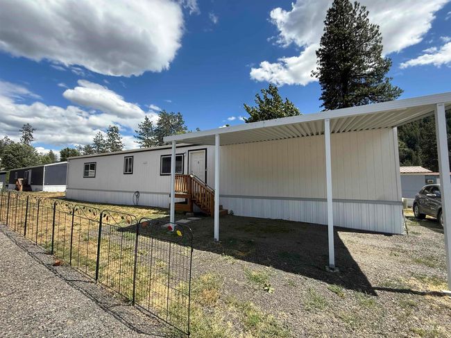 View of front of house featuring a carport | Image 25