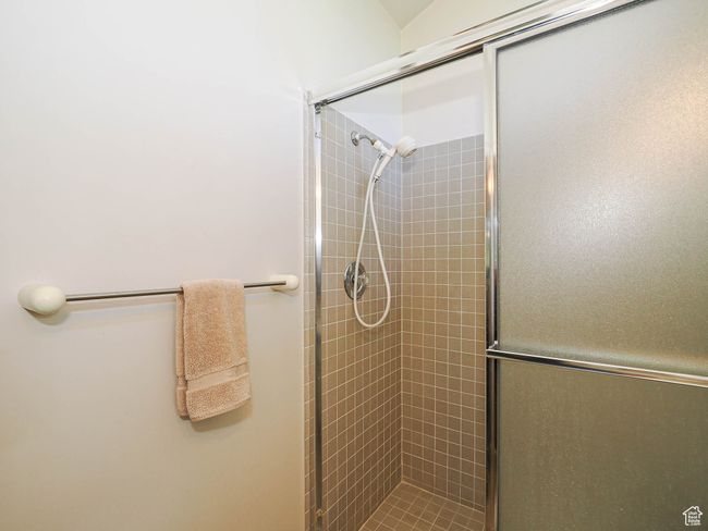 Bathroom featuring a tile shower | Image 41