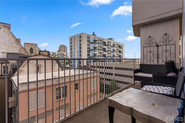Balcony featuring a city view | Image 25