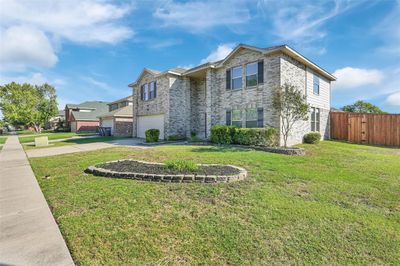 View of front facade with a front lawn | Image 2