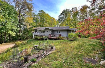 Main veiw of home from driveway to front yard.jpg | Image 1