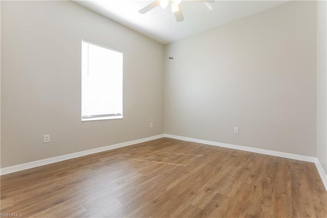 Unfurnished room featuring a ceiling fan and light wood finished floors | Image 11