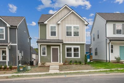 Home 214 - UPGRADED Curb Appeal - High Roof peaks, extra window and Handsome Mountain Sage exterior with Cobblestone colored LOW-Maintenance Hardieboard exterior! | Image 1