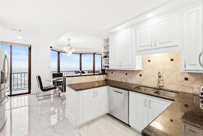 Kitchen area overlooking dinning | Image 4