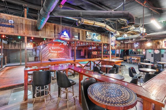 Indoor dry bar featuring wooden walls | Image 24
