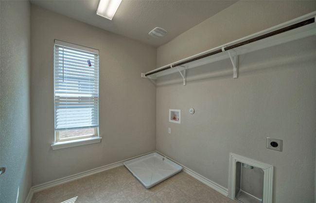Laundry area with washer hookup, baseboards, laundry area, and hookup for an electric dryer | Image 24