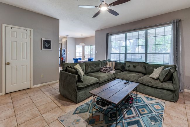 Despite the wide open spaces, this home has a cozy family room off kitchen! Per;fect for movie nights and football parties! | Image 13