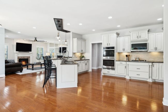 Open-concept design connects kitchen and living area for easy entertaining. | Image 7