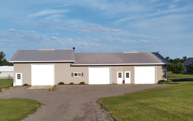 Detached heated garage with lift. | Image 20