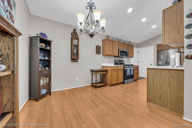 Dining area connects the living room to the kitchen. | Image 16