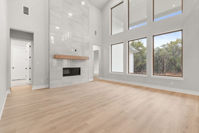 Gorgeous floor to ceiling fireplace in bright & open Family Room | Image 16