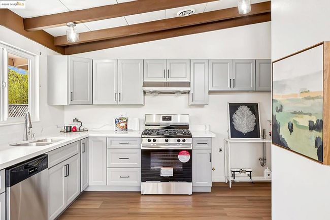 Stylish kitchen with sleek gray cabinetry | Image 13