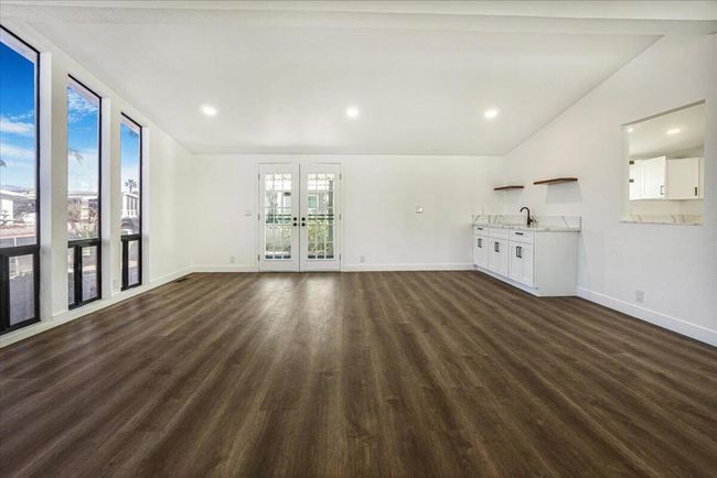 living room view of entry | Image 16