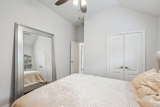 Bedroom #3 featuring vaulted ceiling, a closet, and a ceiling fan. | Image 33