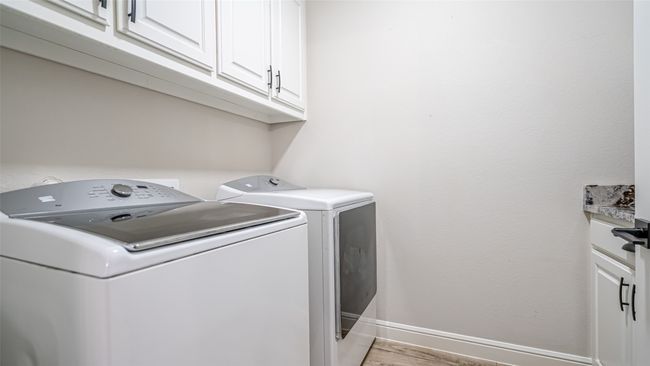 Laundry area with full size W/D hookups & cabinetry | Image 20