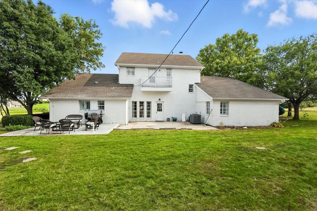 Back of property featuring a patio, brick siding, and a lawn | Image 32