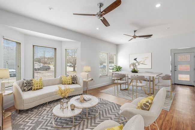 Living room with recessed lighting, a ceiling fan, baseboards, and wood finished floors | Image 4