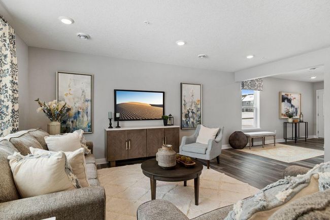 Spacious main level is light & bright with lots of windows and 9-foot knockdown ceilings. Photo is of model home. Colors and options may vary. Ask Sales Agent for details. | Image 12