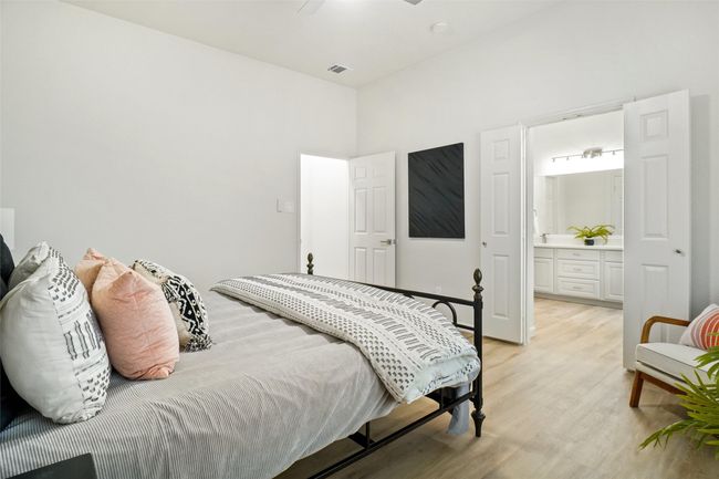 Bedroom with light wood-type flooring and ensuite bathroom | Image 15