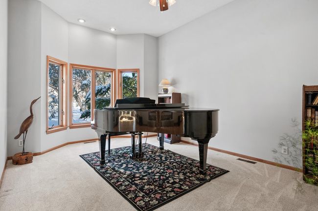 The formal living room is located just inside the main entrance. The fantastic bay windows look out to the front yard. This would also make a great office, playroom, or tv room. | Image 7